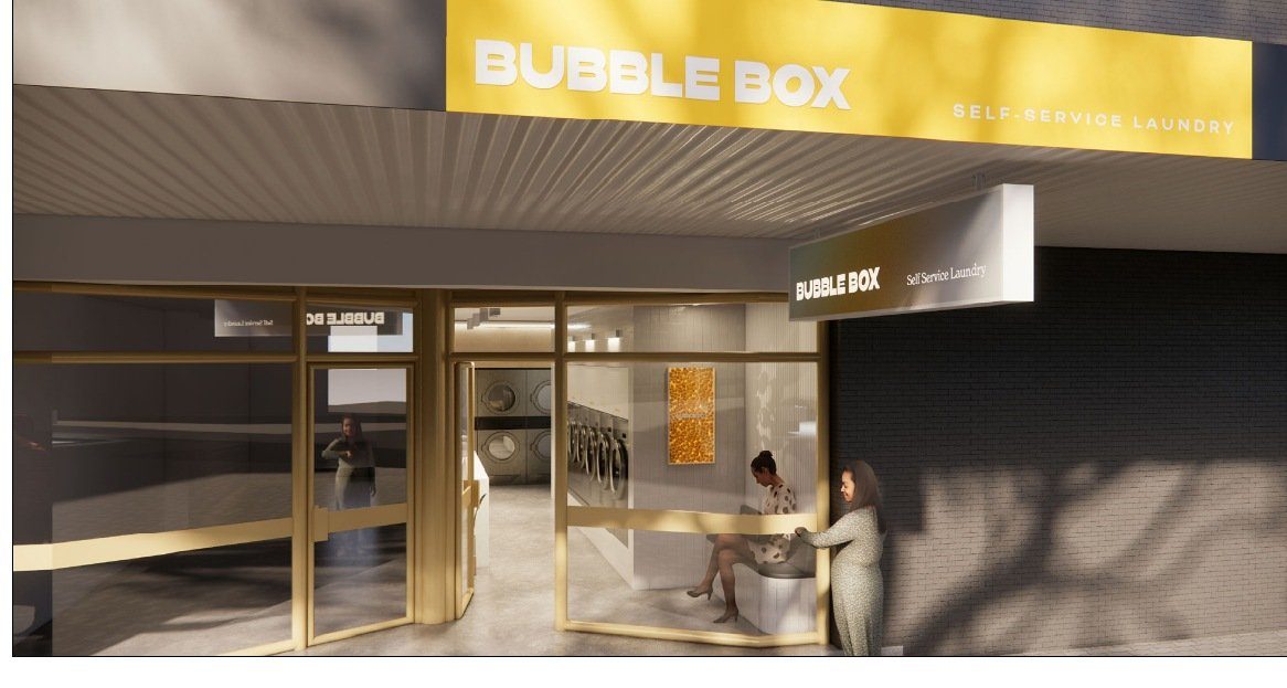 Bubble Box Manly 2.0 storefront render — yellow fascia and glass shopfront